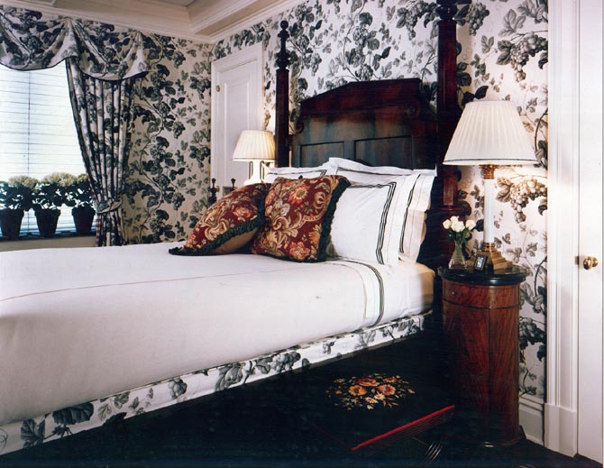 Modern interior of bedroom with floral decoration